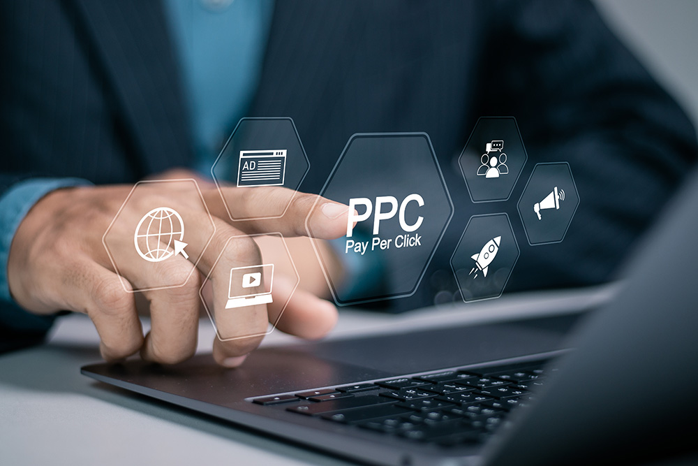 A person clicking a virtual button labeled PPC